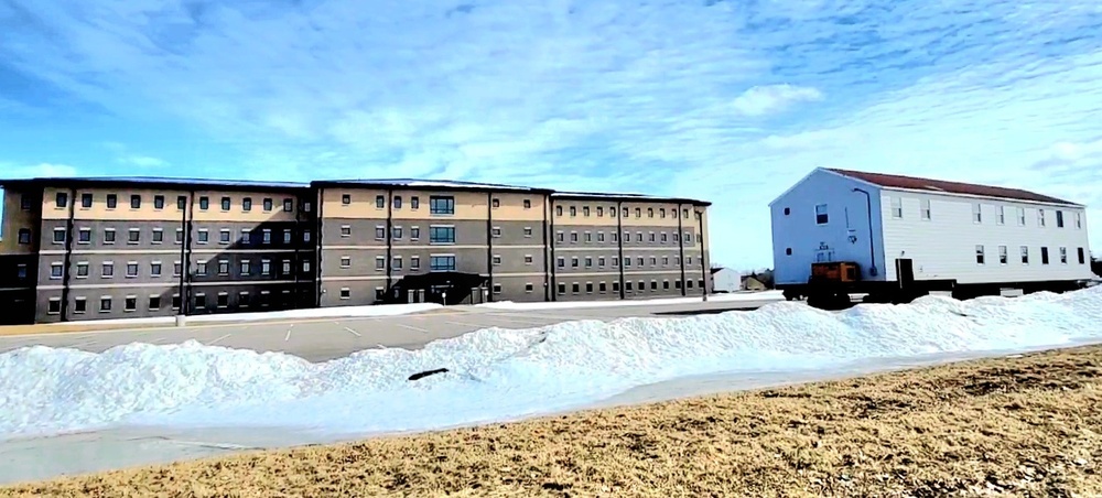 Contractors move second World War II-era barracks building at Fort McCoy