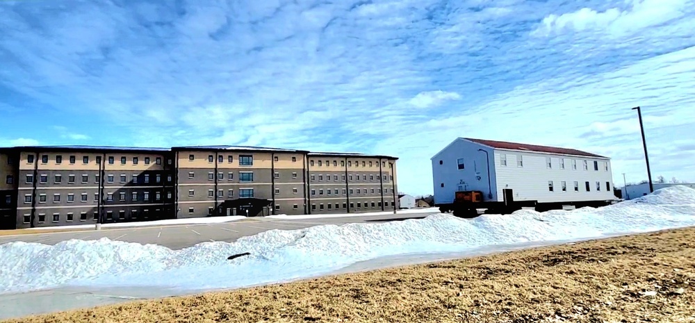 Contractors move second World War II-era barracks building at Fort McCoy