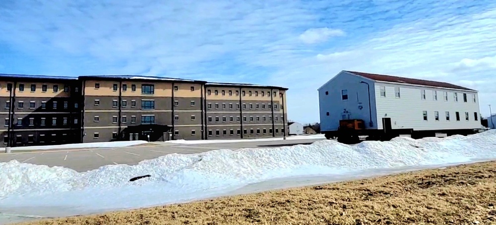 Contractors move second World War II-era barracks building at Fort McCoy