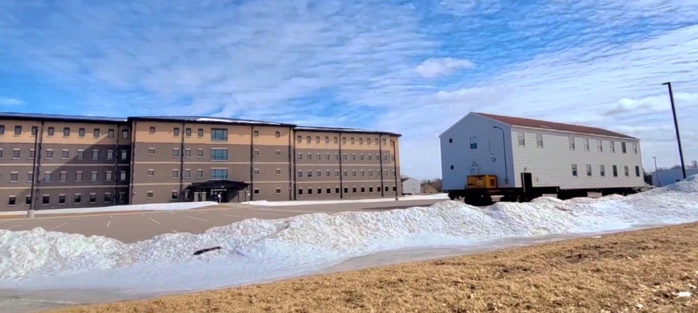 Contractors move second World War II-era barracks building at Fort McCoy