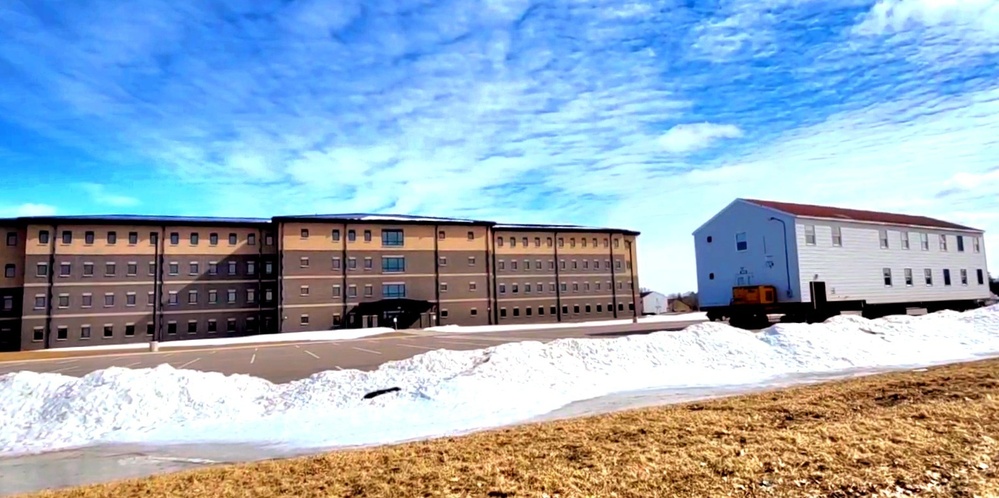 Contractors move second World War II-era barracks building at Fort McCoy