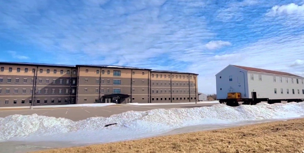 Contractors move second World War II-era barracks building at Fort McCoy