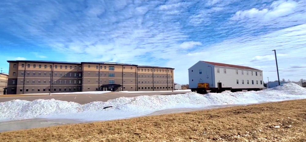 Contractors move second World War II-era barracks building at Fort McCoy