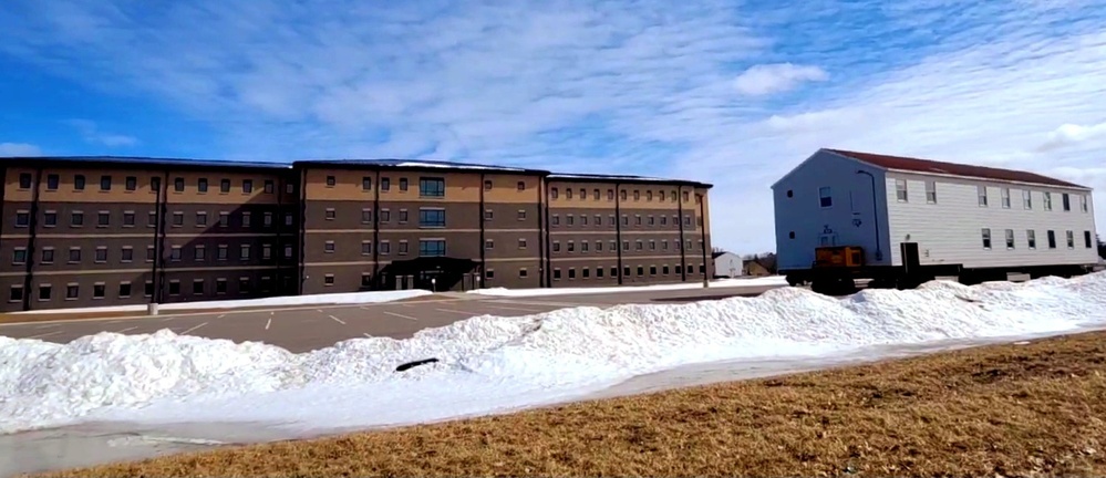 Contractors move second World War II-era barracks building at Fort McCoy