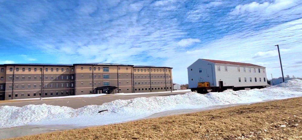 Contractors move second World War II-era barracks building at Fort McCoy