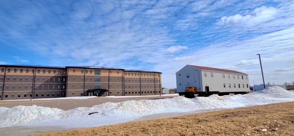 Contractors move second World War II-era barracks building at Fort McCoy