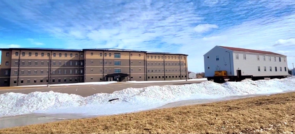 Contractors move second World War II-era barracks building at Fort McCoy