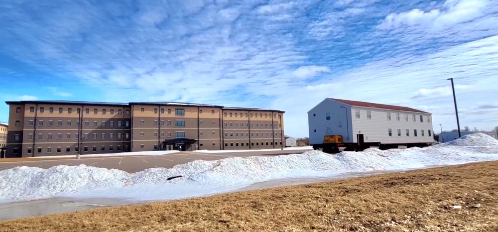 Contractors move second World War II-era barracks building at Fort McCoy