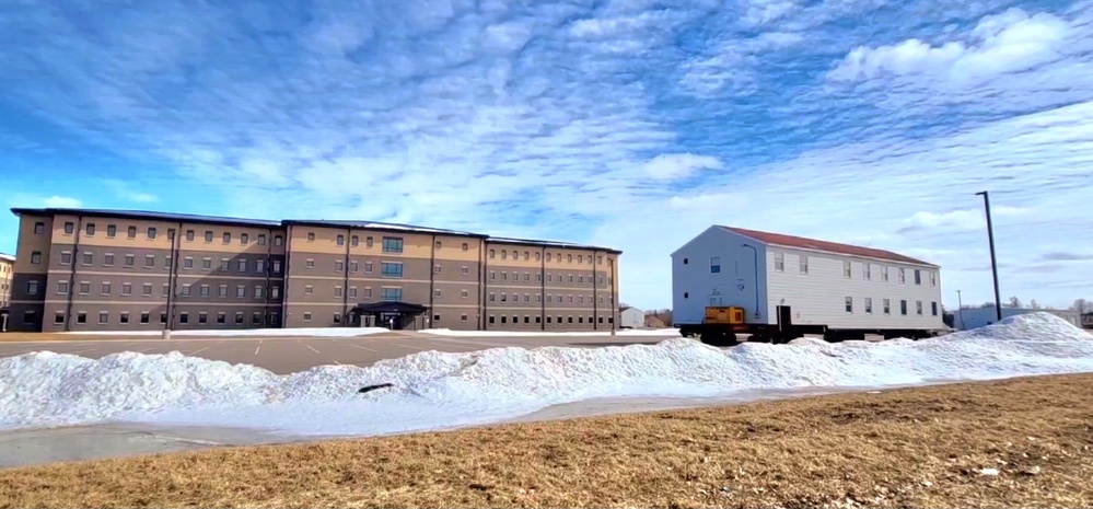 Contractors move second World War II-era barracks building at Fort McCoy