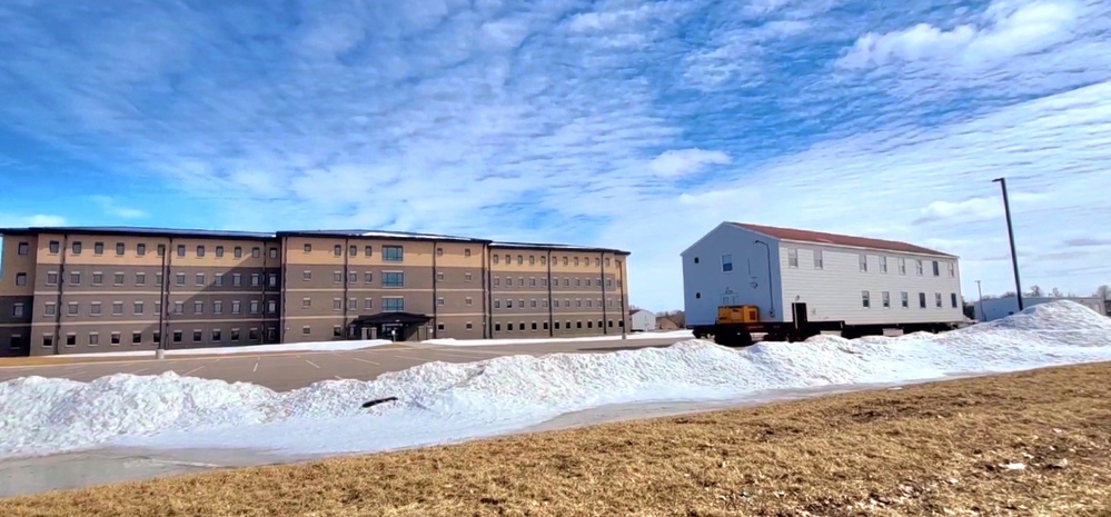 Contractors move second World War II-era barracks building at Fort McCoy