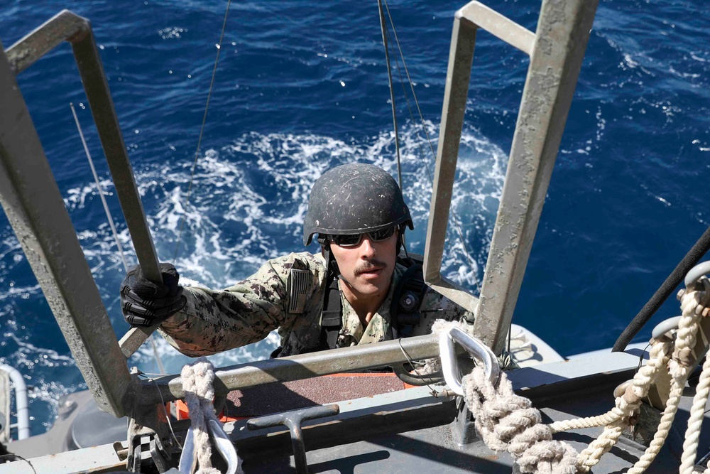 USS Truxtun practices vessel boarding procedures during IMX 23