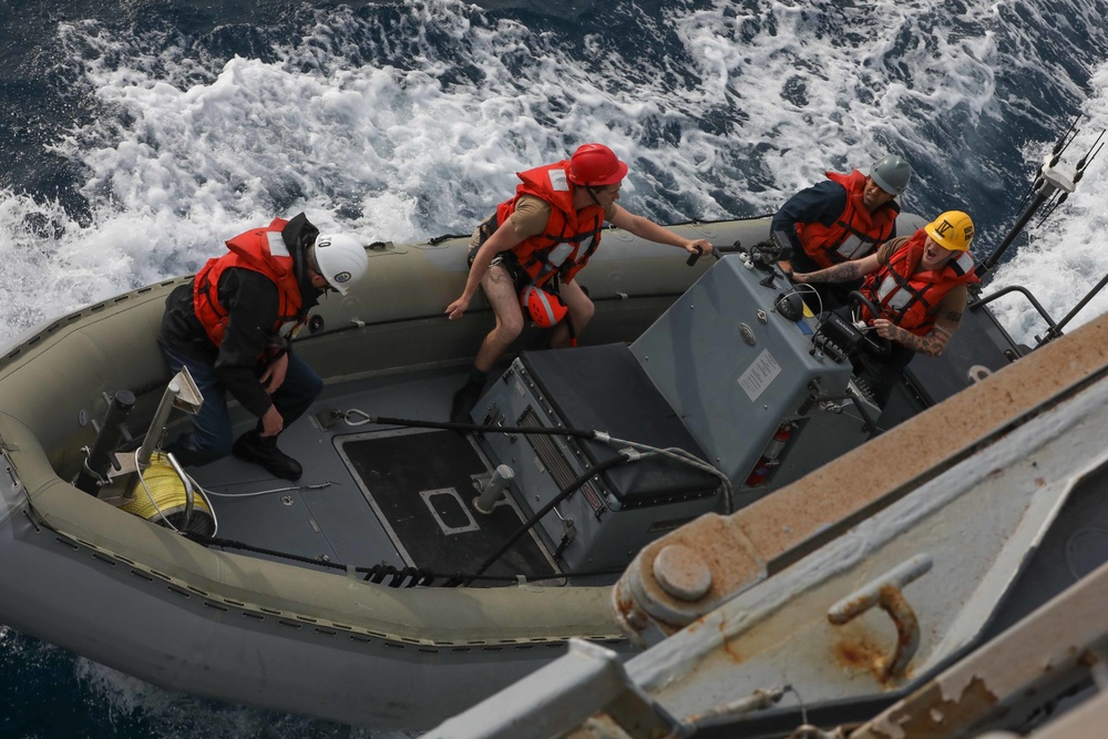 USS Thomas Hudner (DDG 116) depart the ship on a rigid-hulled inflatable boat