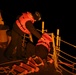 USS Thomas Hudner (DDG 116) prepare to conduct a passenger transfer