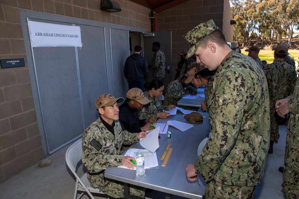 Abraham Lincoln Sailors take advancement exams