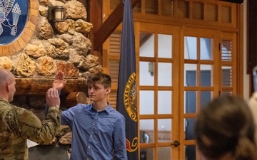 Carrying the torch: chief promotes, son enlists.