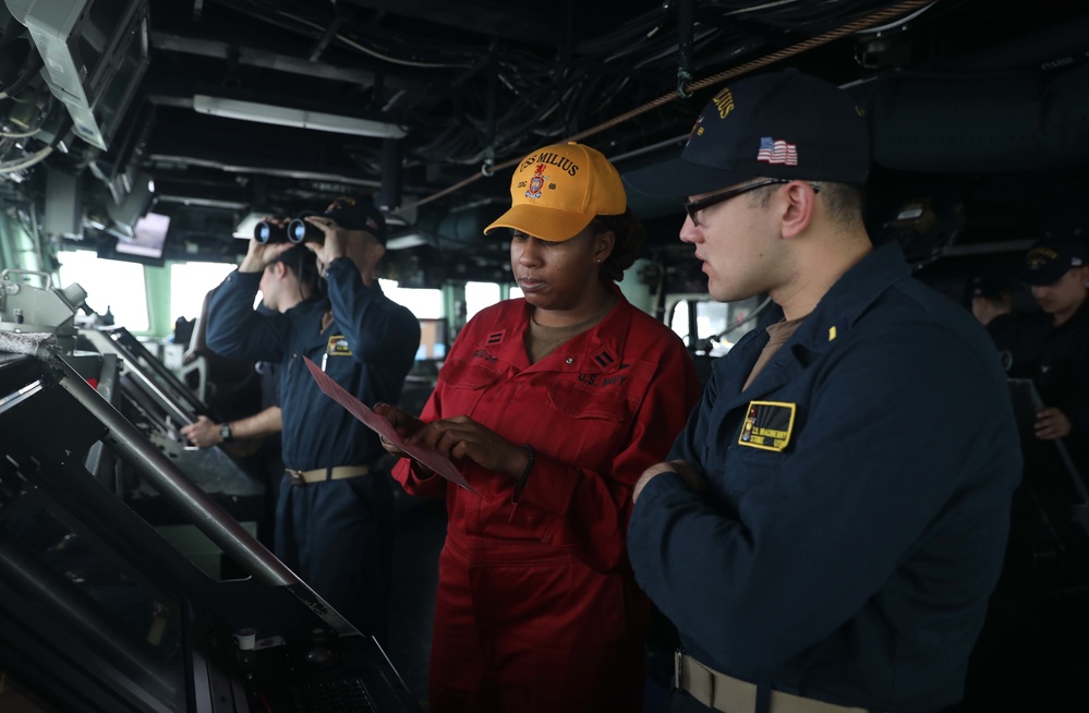 USS Milius Sailors Stand Watch on the Ship's Bridge While Operating in the Philippine Sea