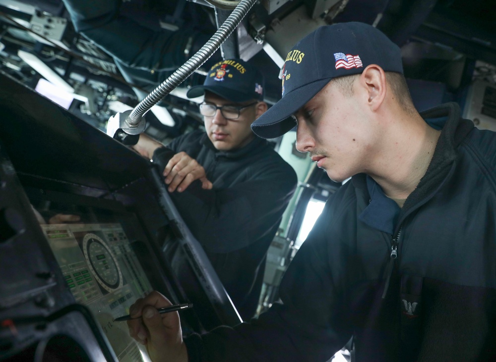 USS Milius Sailors Stand Watch on the Ship's Bridge While Operating in the Philippine Sea