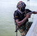 A member of Ghana Armed Forces Holds His Position While Other Team members Climb up a Ladder Flintlock 2023