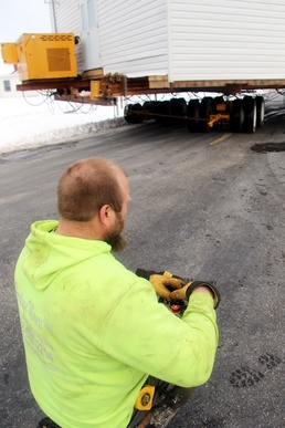 History made: Contractor moves first two World War II-era barracks at Fort McCoy