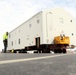 History made: Contractor moves first two World War II-era barracks at Fort McCoy