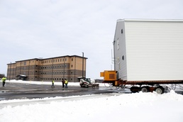 History made: Contractor moves first two World War II-era barracks at Fort McCoy