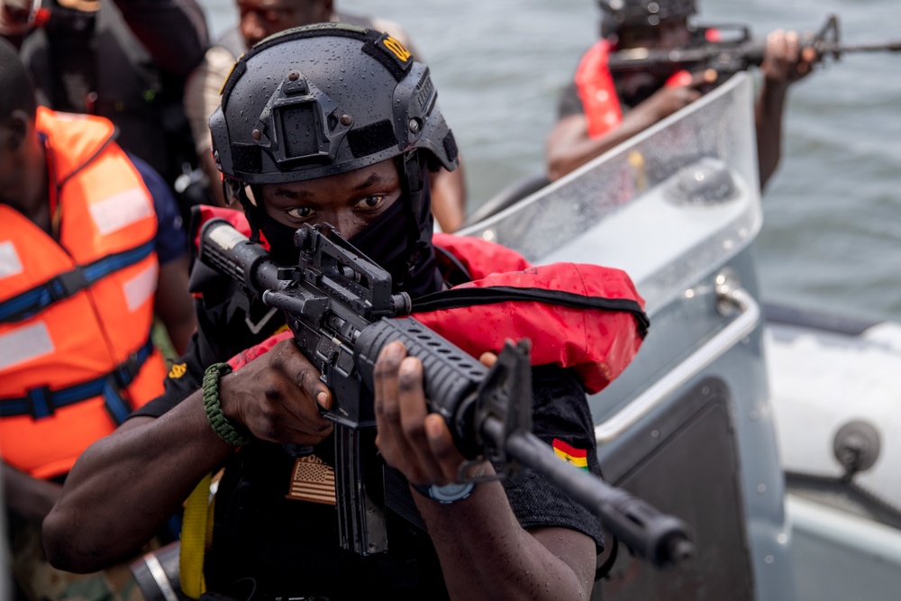 A Member of The Ghana Armed Forces Pulls Security