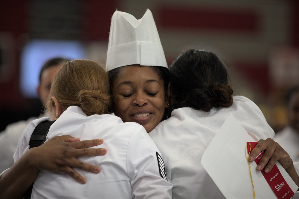 Air Force friends embrace