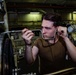 Sailor Removes Bolts From A Jet Engine