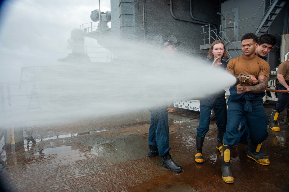 Sailor Discharges Firehose