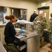 A Sailor demonstrates her portion control as she serves command leadership.