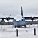 C-130 Hercules training aircraft covered in snow at Fort McCoy