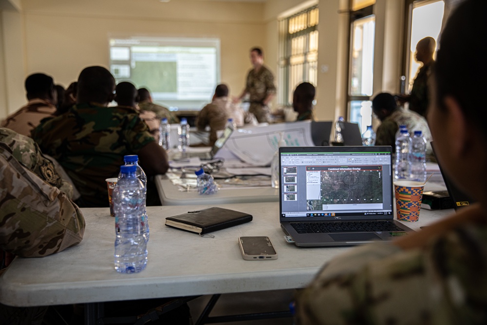 Members from a multinational force plan operations