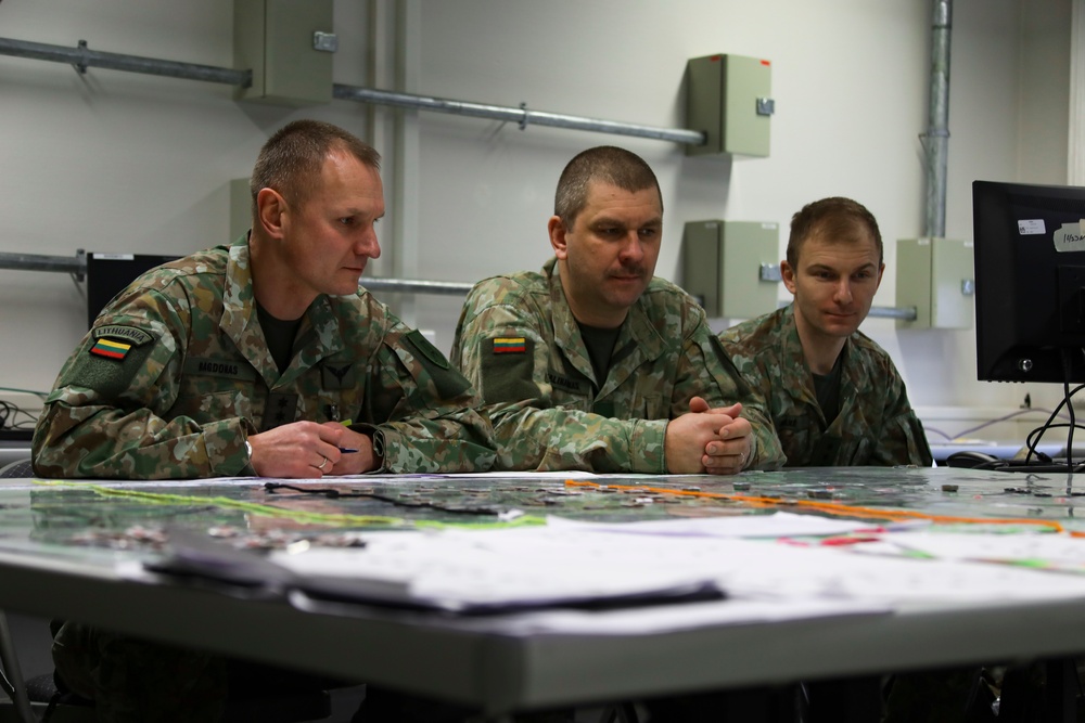 Lithuanian Soldiers listen  to a brief given by U.S. Army 4th ID Counterfire Officer during JMSC-hosted, Allied Spirit 23 CPX 1