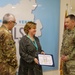 SETAF-AF leaders award certificate of appreciation at local hospital