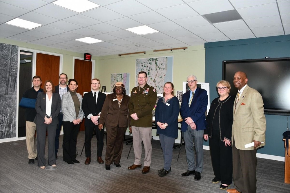 LTC Broderick, Jeff Zuercher and Patrick Kennedy with members of the Lake County Forest Preserve board during the Des Plaines River Project press conference.