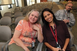 Janet Jones, retired, and Diana McCoy, Kansas City District public affairs chief, smile together.