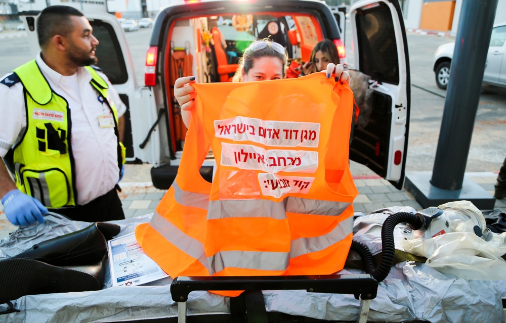 MADA First Responder displays a safety vest during a capabilities show and tell