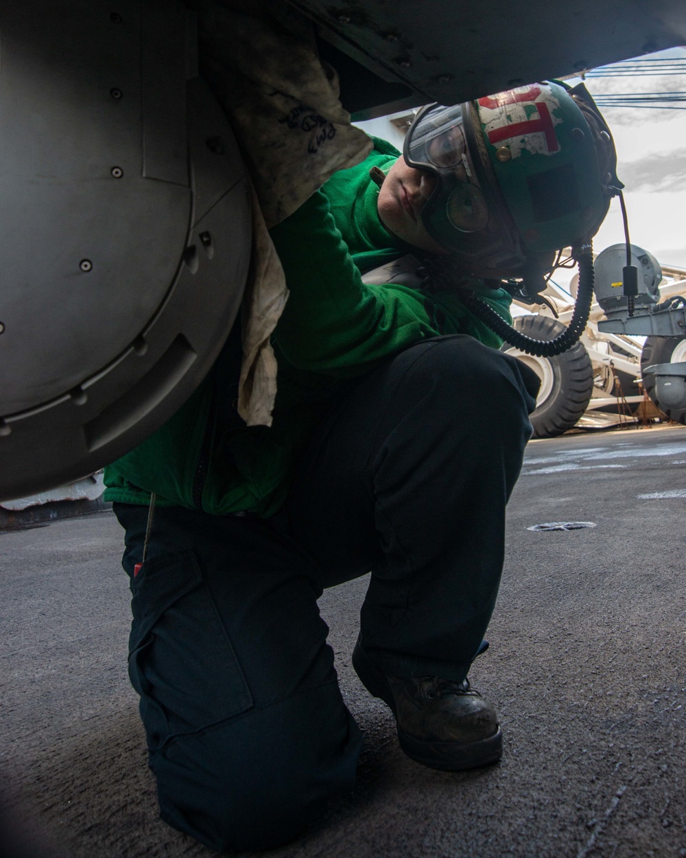 Sailor Cleans Aircraft