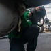 Sailor Cleans Aircraft