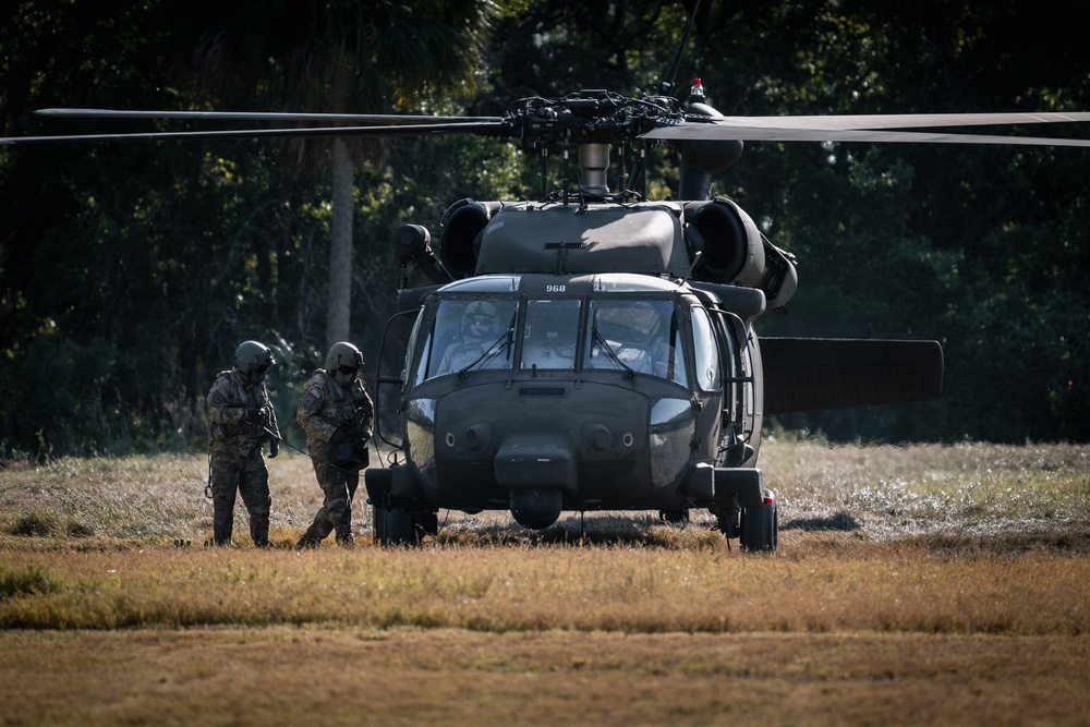 Army reserve conduct rappel training onboard a UH-60 Blackhawk