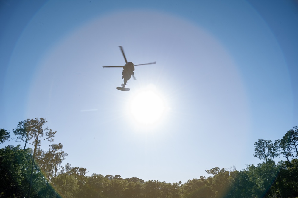 Army reserve conduct rappel training onboard a UH-60 Blackhawk