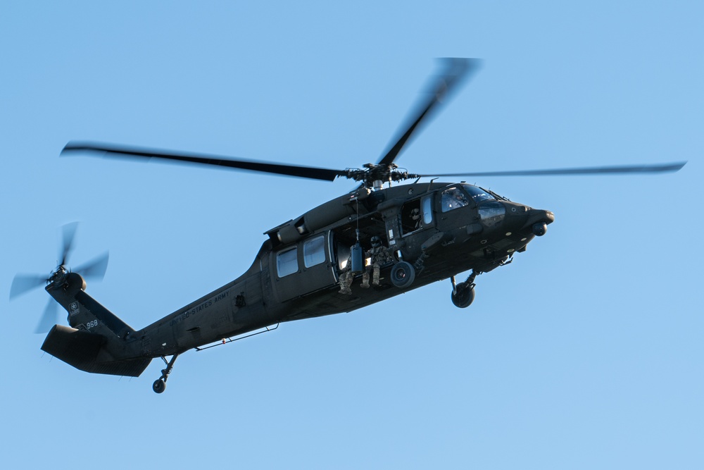 Army reserve conduct rappel training onboard a UH-60 Blackhawk