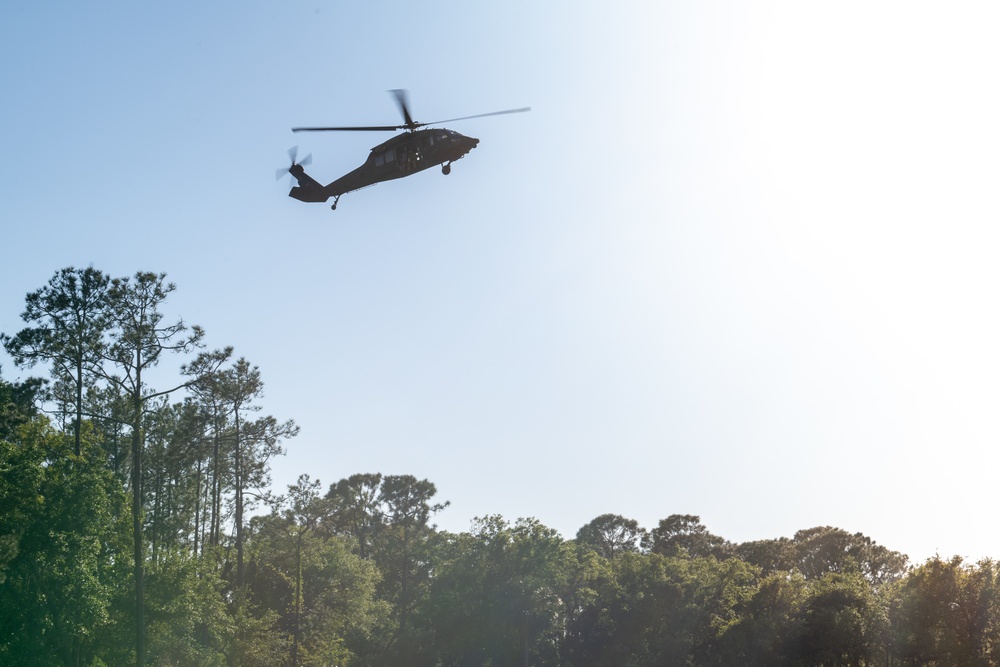 Army reserve conduct rappel training onboard a UH-60 Blackhawk