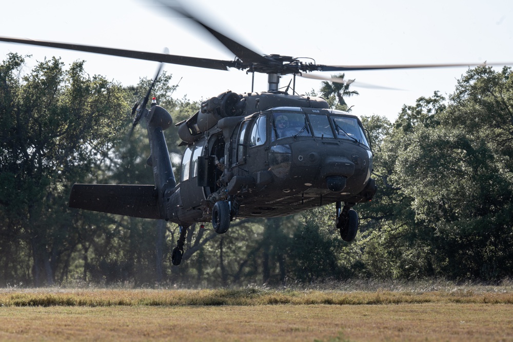 Army reserve conduct rappel training onboard a UH-60 Blackhawk