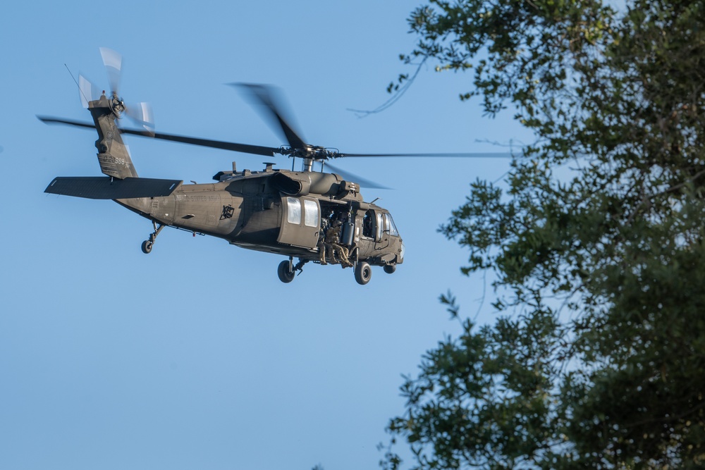 Army reserve conduct rappel training onboard a UH-60 Blackhawk