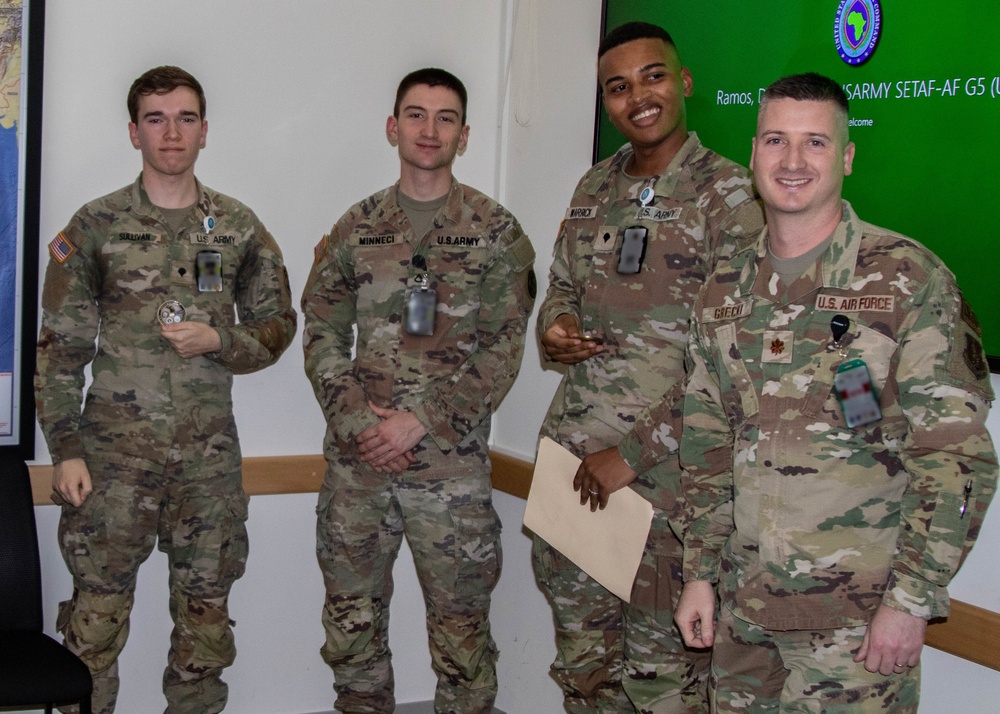 SETAF-AF intelligence analysts receive coins from Michigan National Guard