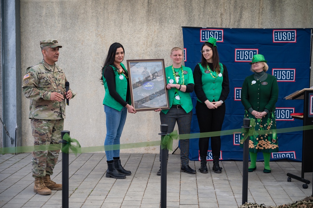 USO Personnel Pose with a new Poster from Command Sergeant Major Yazzie