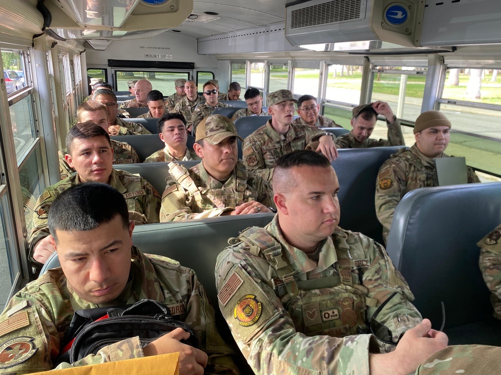 452 AMW Airmen ride in bus for Exercise Operation Lifesaver