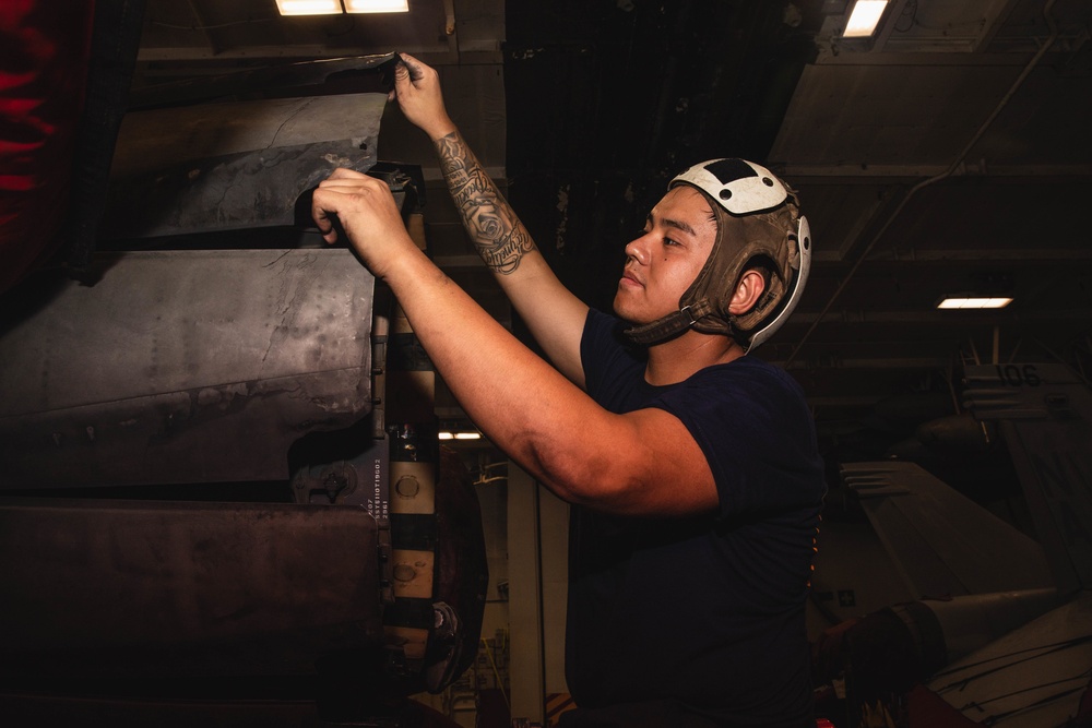 U.S. Sailor Inspects F/A-18E Exhaust