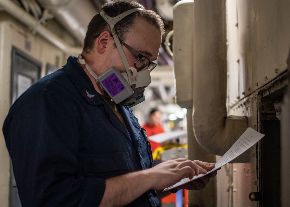 Sailor Performs Maintenance On Fan Coil Unit